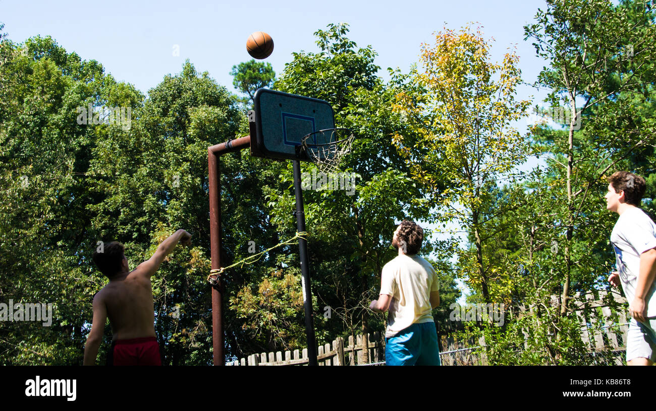Brothers Playing Basketball Stock Photo Alamy