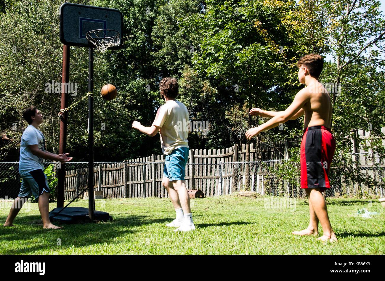 Brothers Playing Basketball Stock Photo Alamy