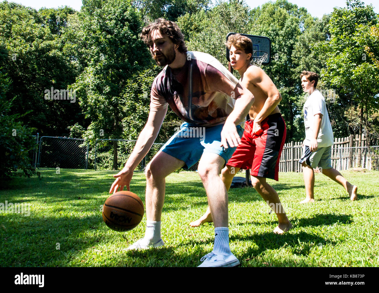 Brothers Playing Basketball Stock Photo Alamy