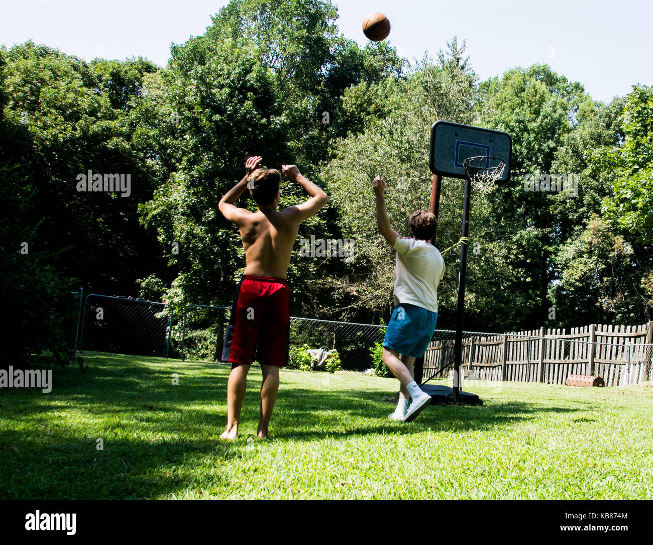 Brothers Playing Basketball Stock Photo Alamy