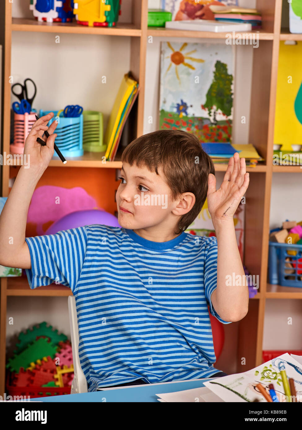 Small students boy painting in art school class Stock Photo - Alamy