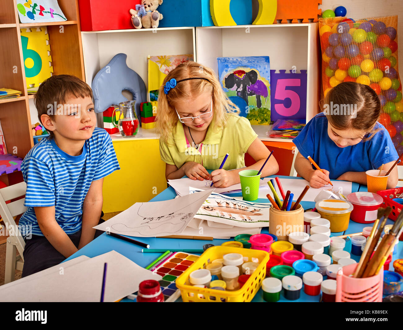 Small students children painting in art school class Stock Photo - Alamy