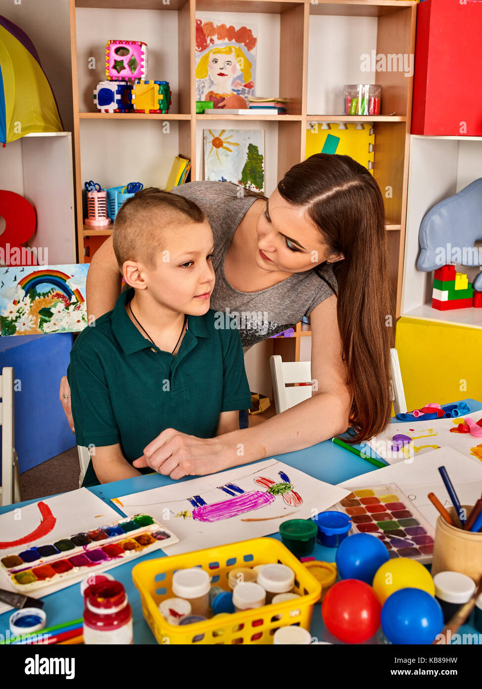 Small students girl and boy painting in art school class Stock Photo ...