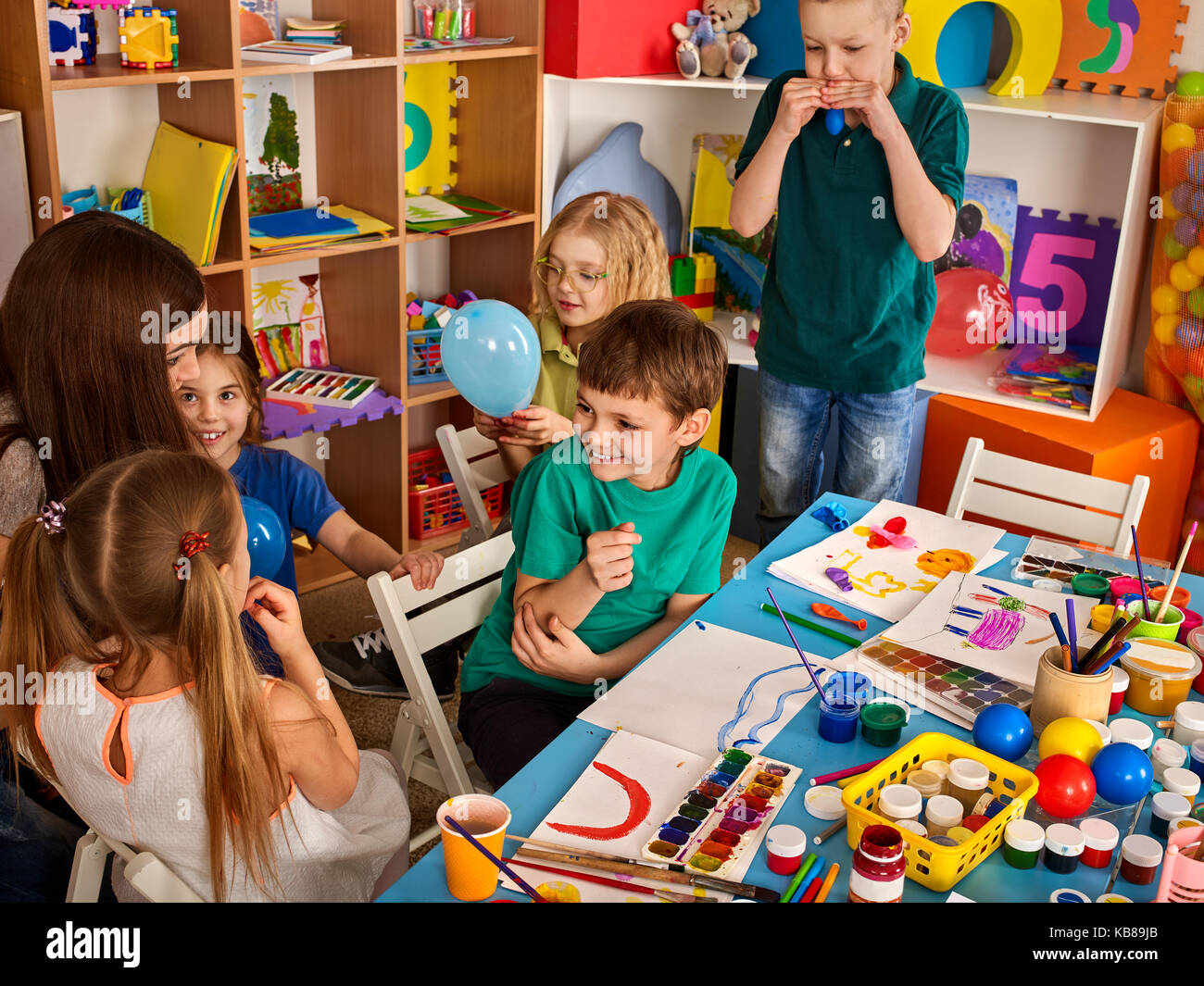 Small students girl and boy painting in art school class Stock Photo ...