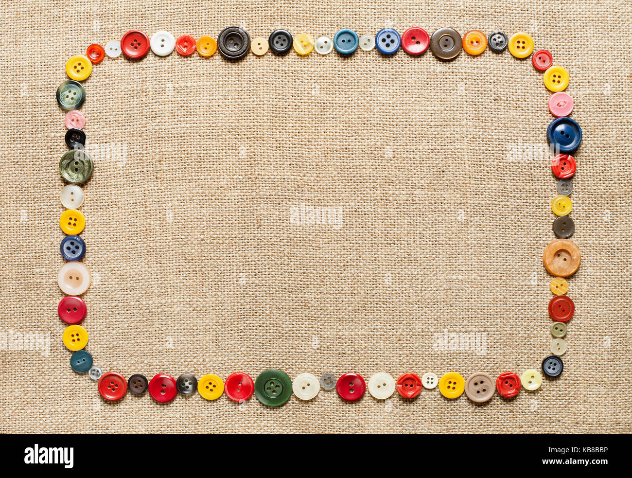 Buttons frame on fabric texture background Stock Photo - Alamy