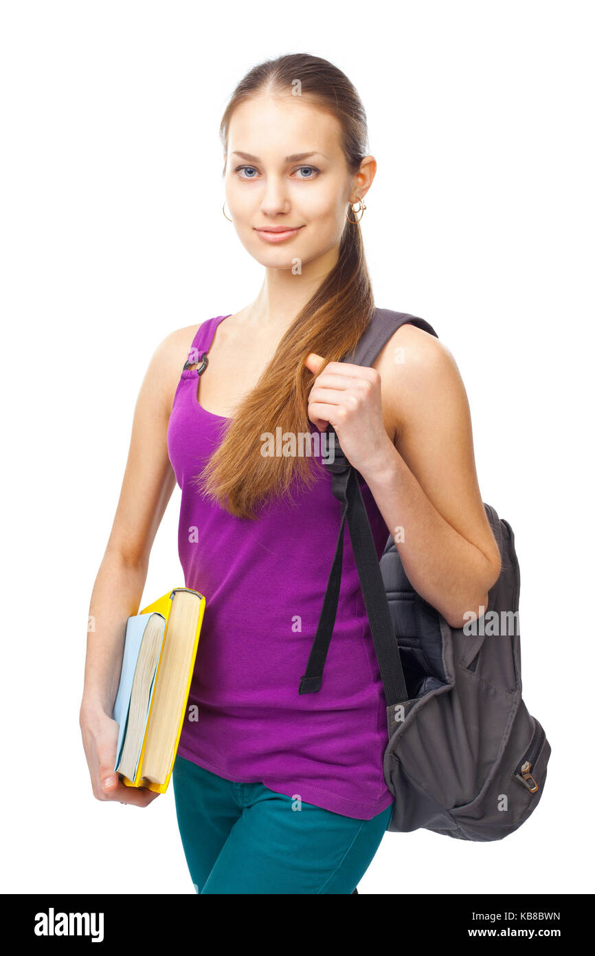 Portrait of a pretty young smiling student girl with books and backpack ...