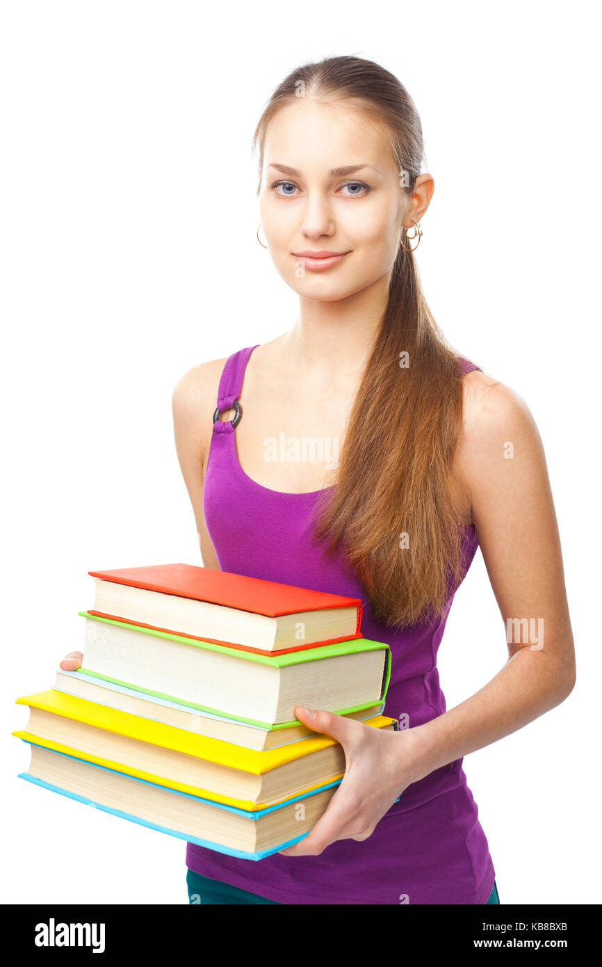 Portrait of a pretty smiling student girl holding stack of books ...