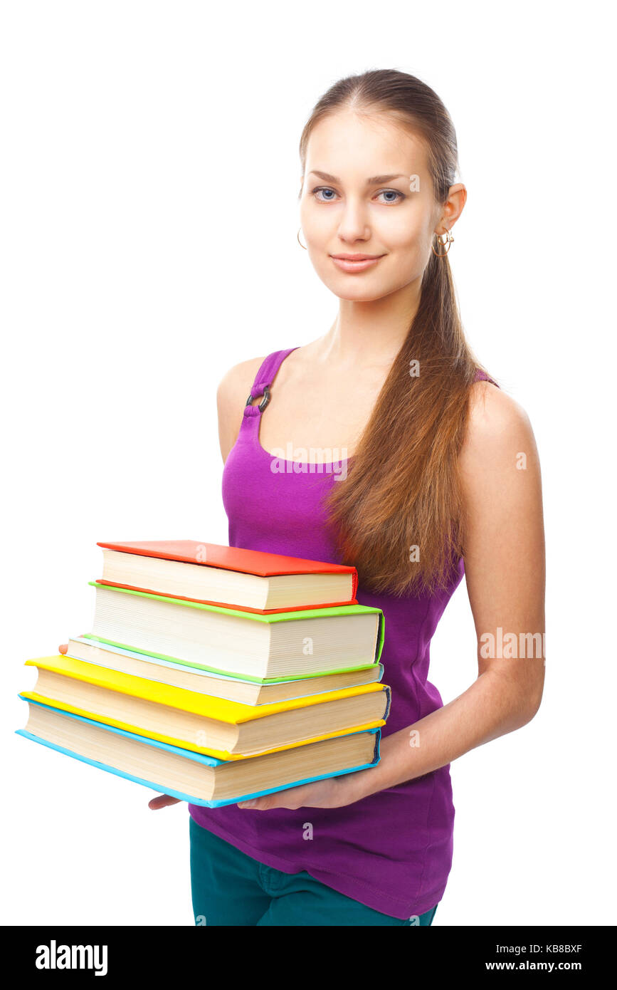 Portrait of a pretty smiling student girl holding stack of books ...