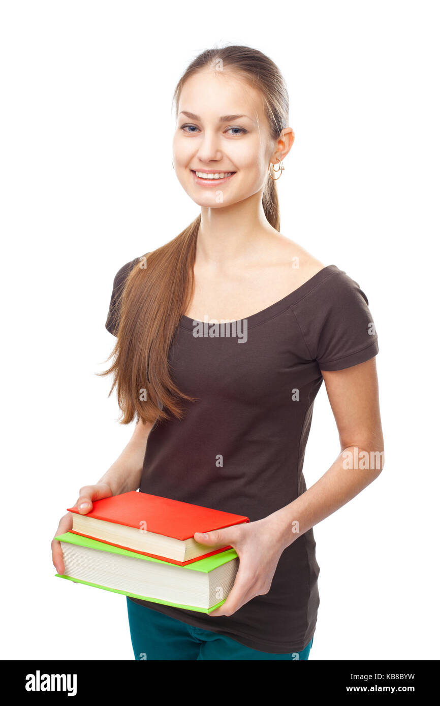 Portrait of a pretty young happy smiling student girl holding stack of ...