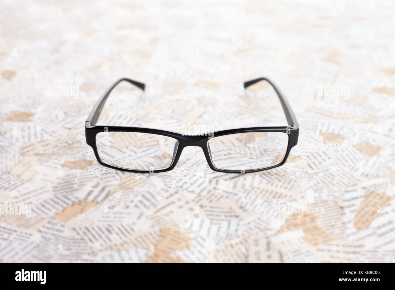 reading glasses on paper background Stock Photo - Alamy