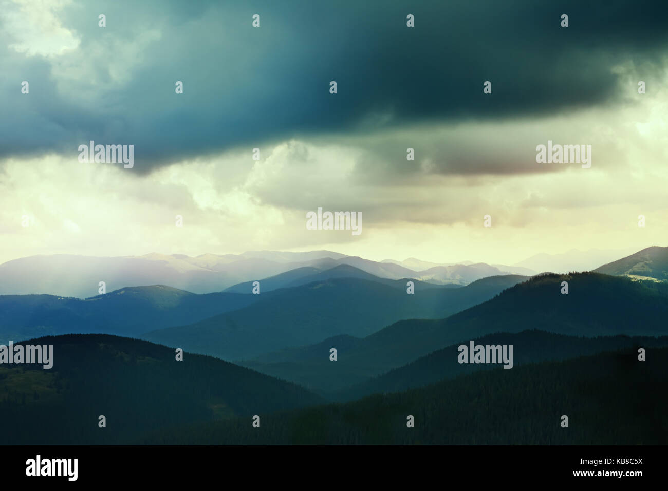 Landscape of nature. Dark clouds over the mountains Stock Photo - Alamy