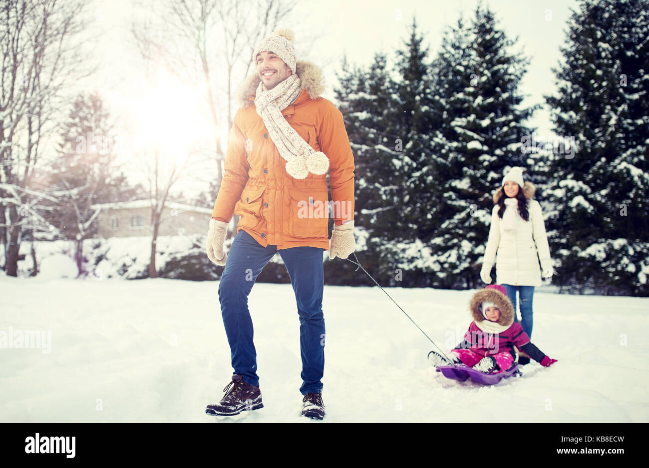 happy family with sled walking in winter outdoors Stock Photo - Alamy