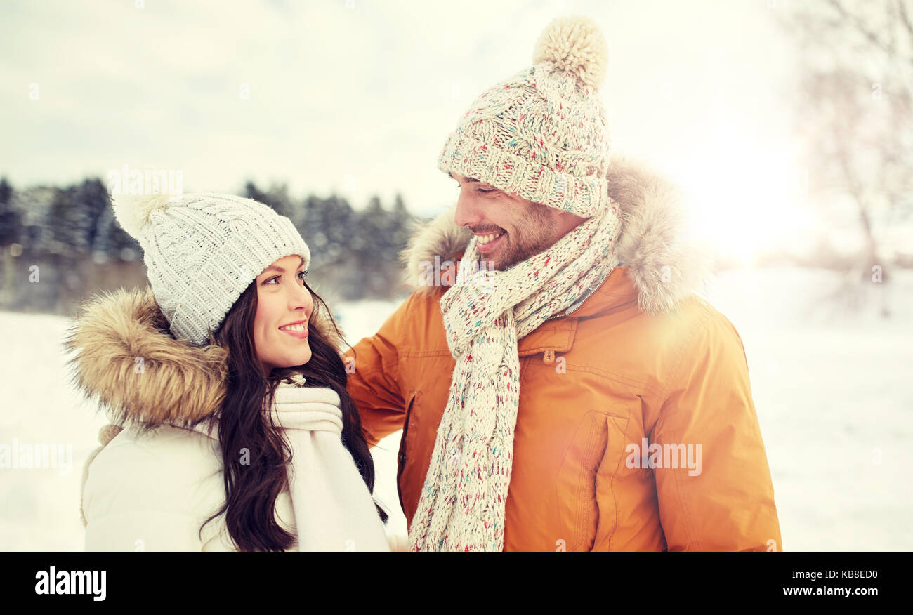 happy couple walking over winter background Stock Photo - Alamy