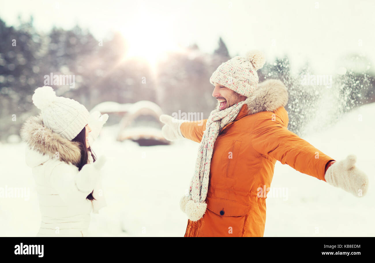 happy couple playing with snow in winter Stock Photo - Alamy