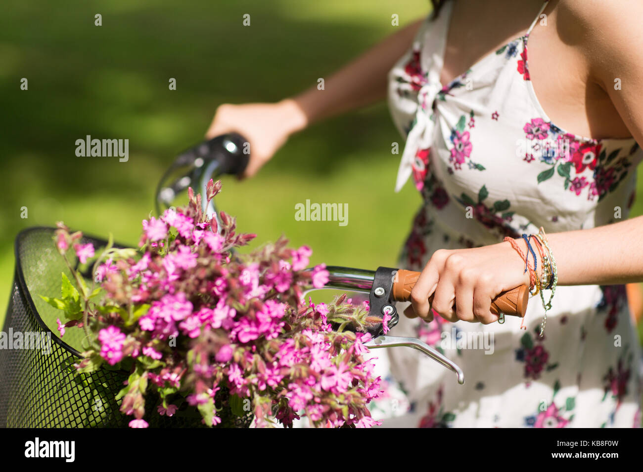 close up of woman riding fixie bicycle outdoors Stock Photo