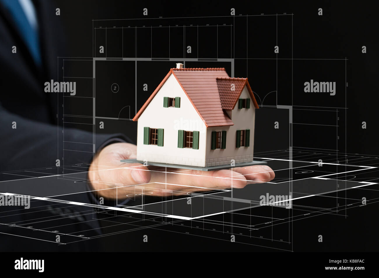 close up of businessman hand holding house model Stock Photo - Alamy