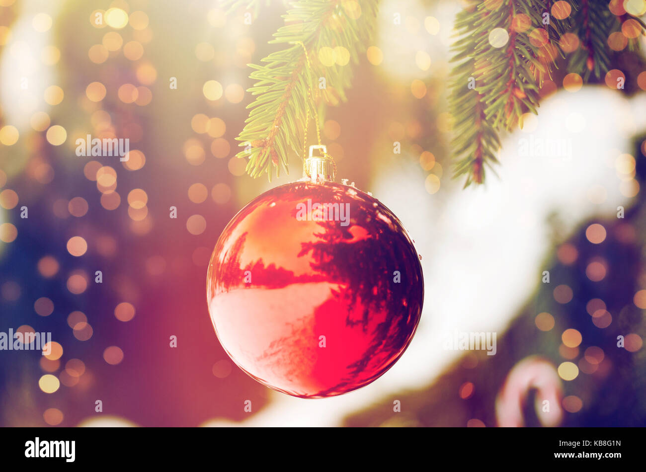 red christmas ball on fir tree branch with snow Stock Photo - Alamy