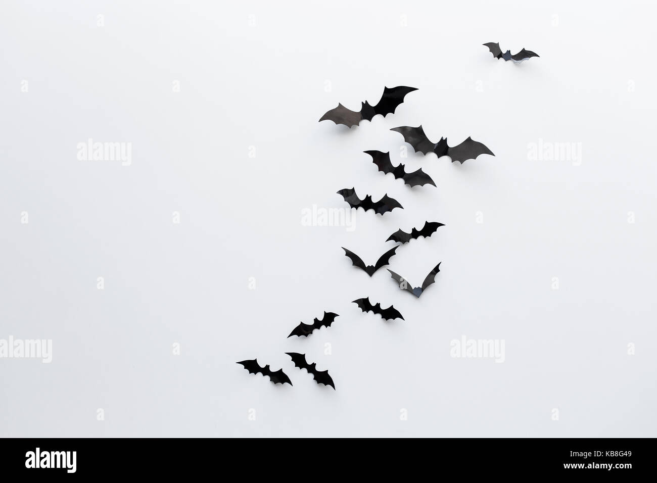 black paper bats over white background Stock Photo - Alamy