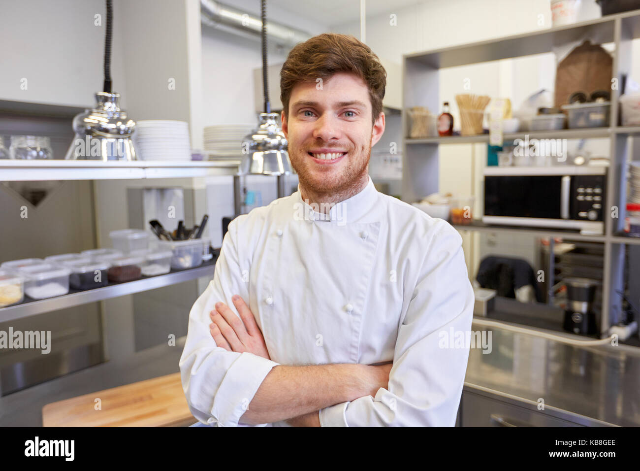 happy male chef cook at restaurant kitchen Stock Photo