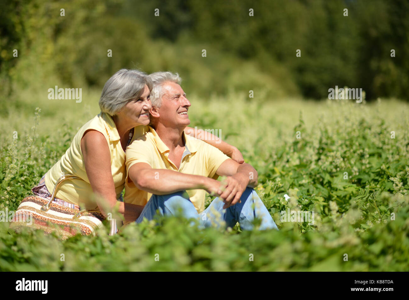 couple sitting in the park Stock Photo - Alamy
