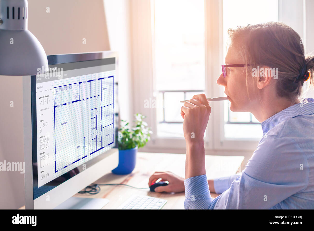 Architect working on computer software to design blueprint floor plan sketch of the construction project, architecture concept Stock Photo