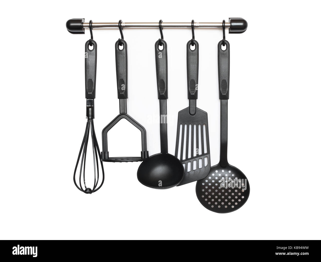 Set of black modern kitchen utensil hanging on white background Stock Photo