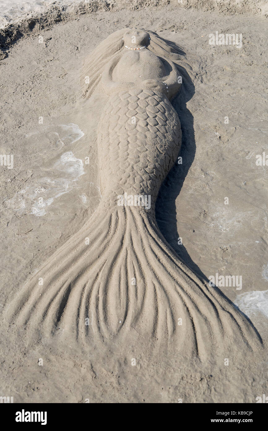 Sculpture of a mermaid with sand on the beach Stock Photo Alamy