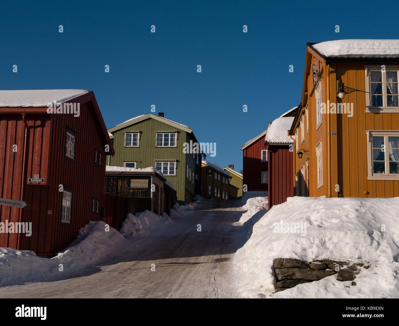 Old historic part of Röros, Norway, Europe. Colourful wooden houses. Blue sky and sunshine. Stock Photo