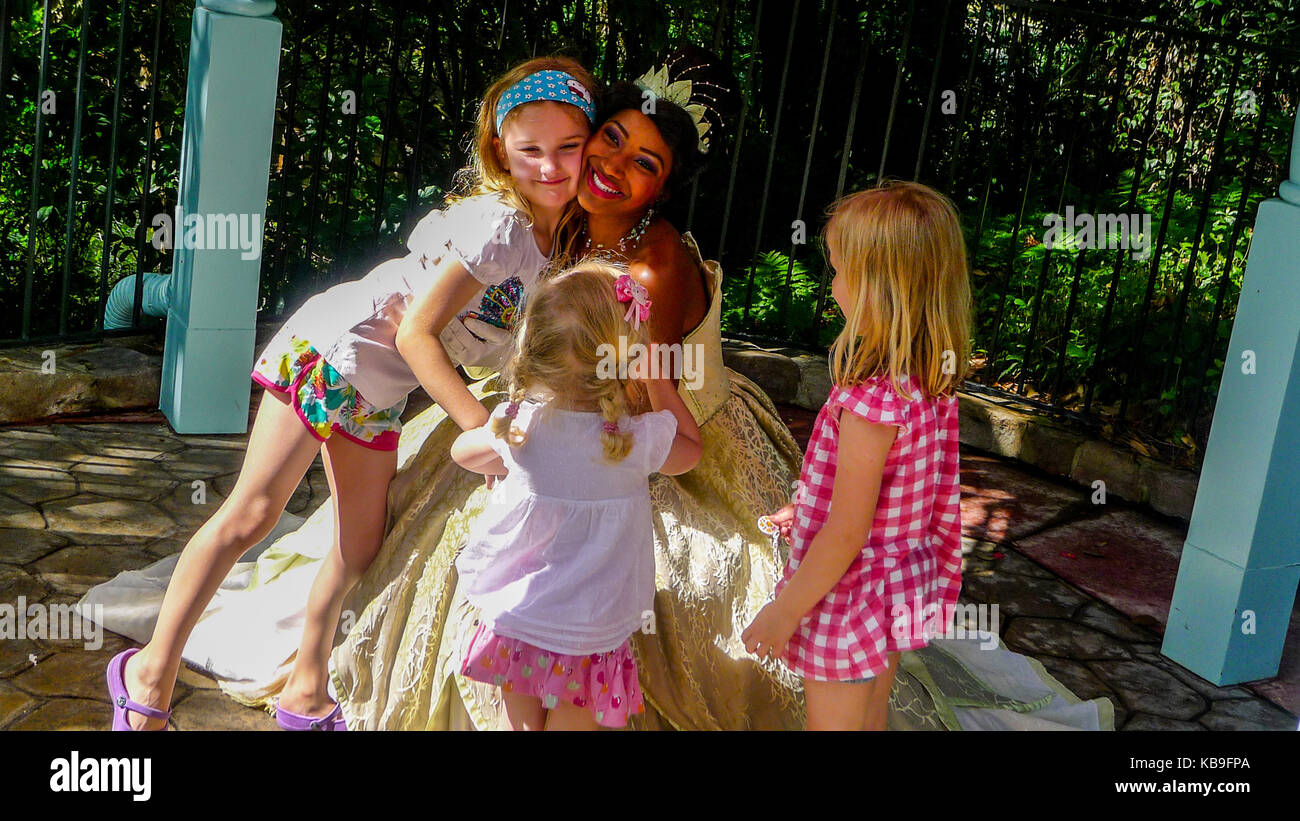 Children kids meeting Princess Tiana, The Princess and the Frog, Magic Kingdom, Disney World, Orlando, Florida, USA Stock Photo