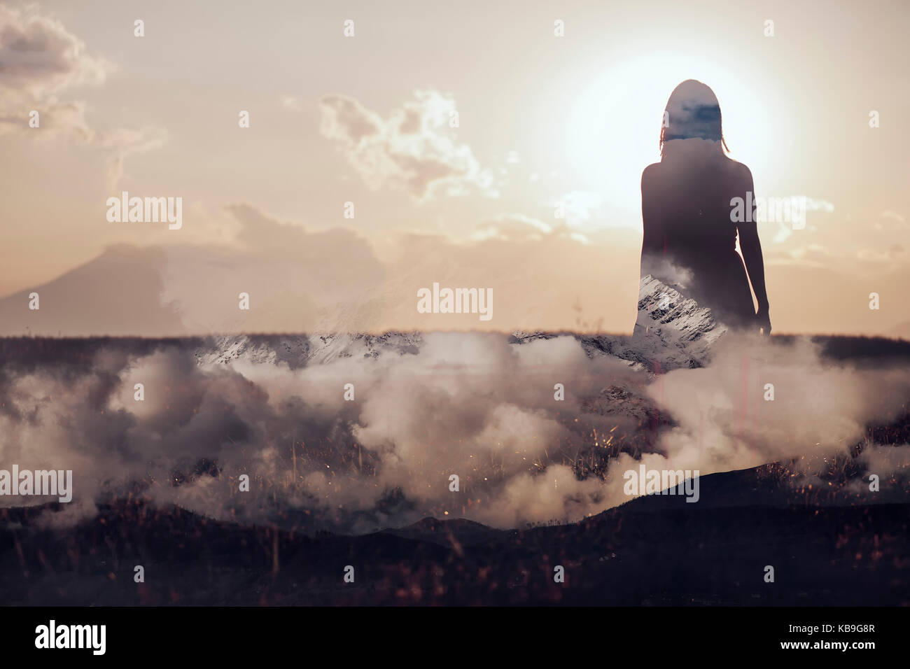 Woman walking on clouds Stock Photo Alamy