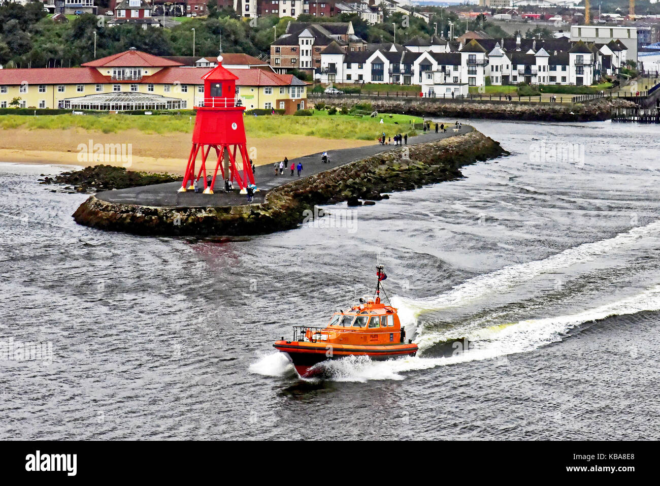 South Shields Herd Groyne old lighthouse and pilot boat Collingwood in the rain Stock Photo