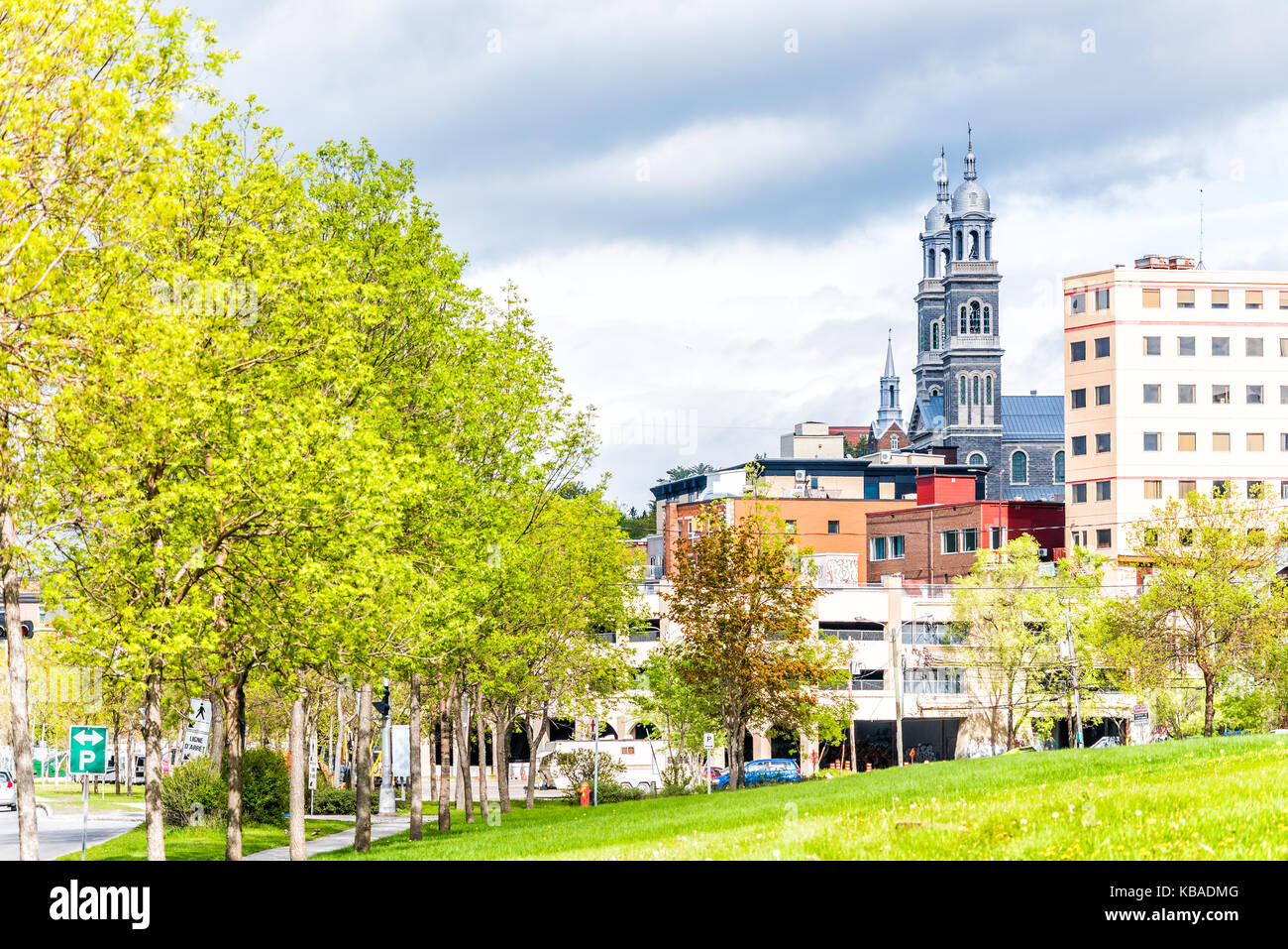 Cityscape or skyline of Saguenay city in Quebec, Canada with church, buildings, road Stock Photo