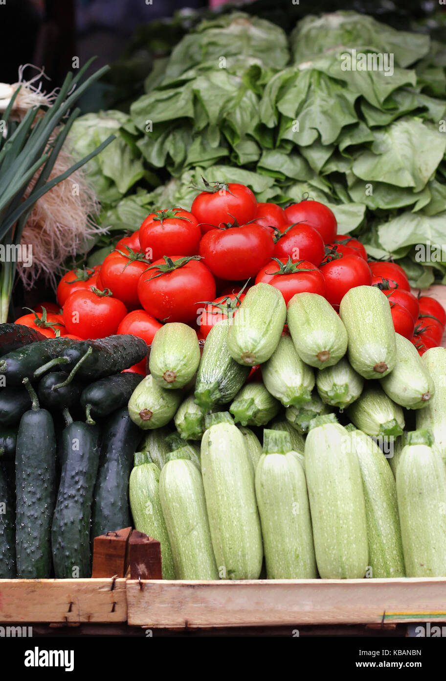 Fresh organic vegetables pile on market stall Stock Photo - Alamy