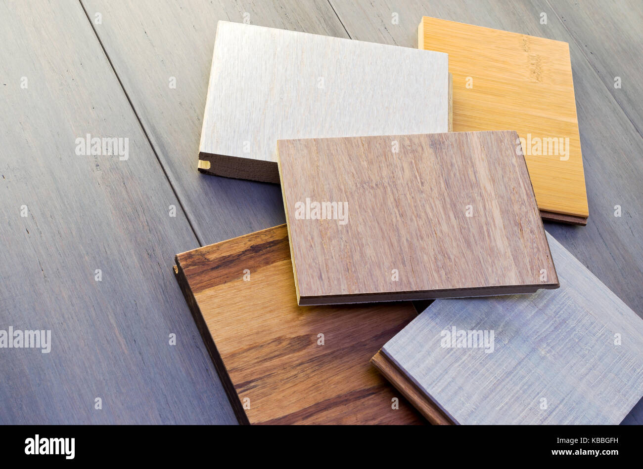 five flooring sample pieces tongue and groove design on top of wide
