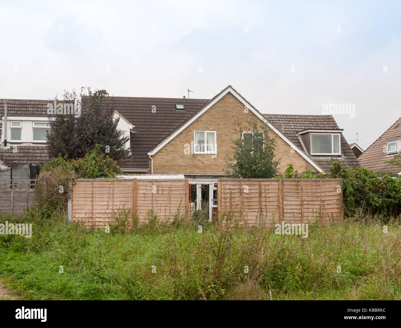 backyard of house with wooden fence outside scene; Essex; England; UK