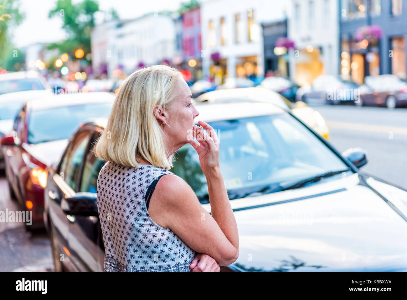 Blond female smoking cigarette hi-res stock photography and images - Alamy