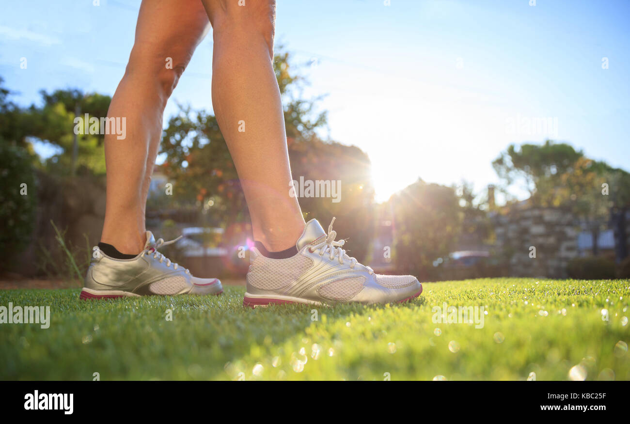 Woman waking in nature, closeup on shoes Stock Photo