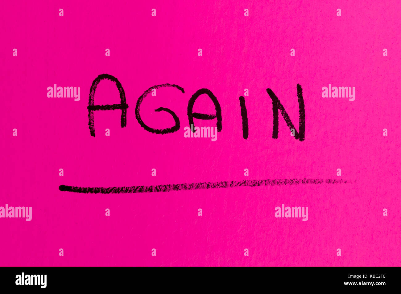 AGAIN word made with spray paint on pink background Stock Photo - Alamy