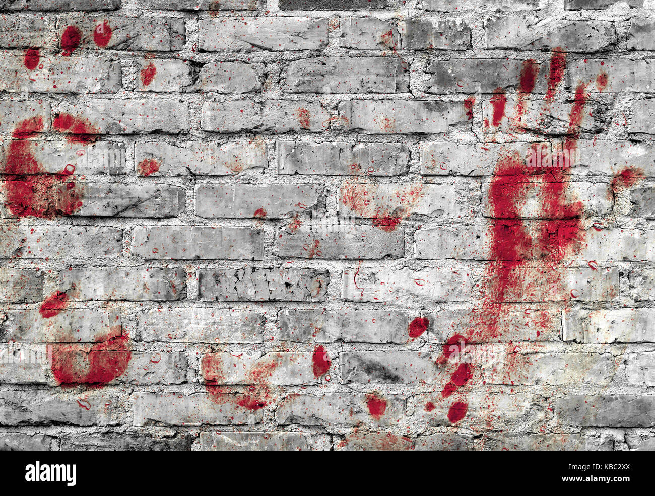 Bloody handprints and blotches of blood on grunge wall. Background for