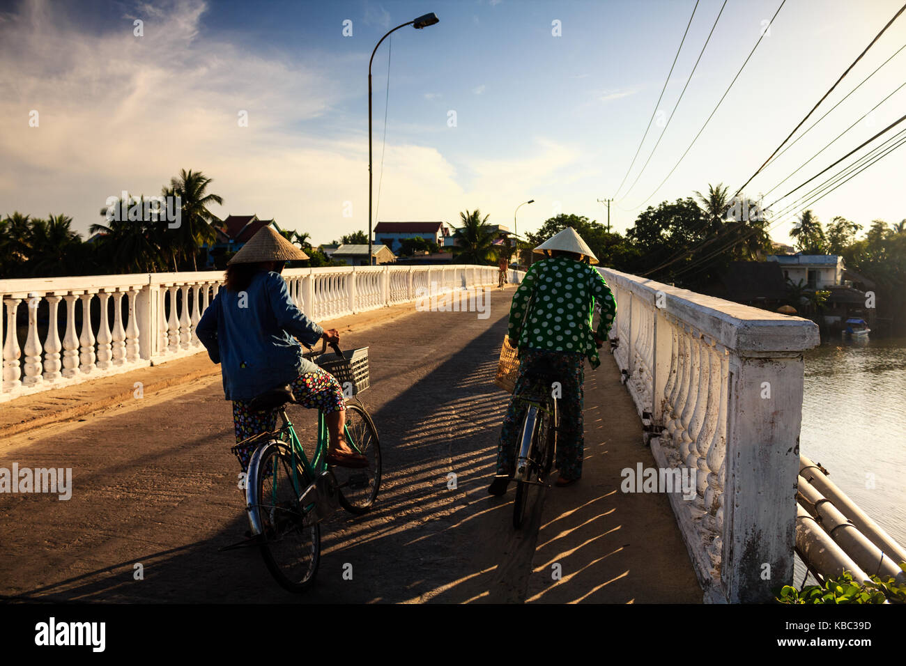 Two local women are on the way to local market, Quang Nam, Vietnam. Quang Nam has 2 UNESCO World Heritage Sites: Hoi An ancient town and the My Son Stock Photo