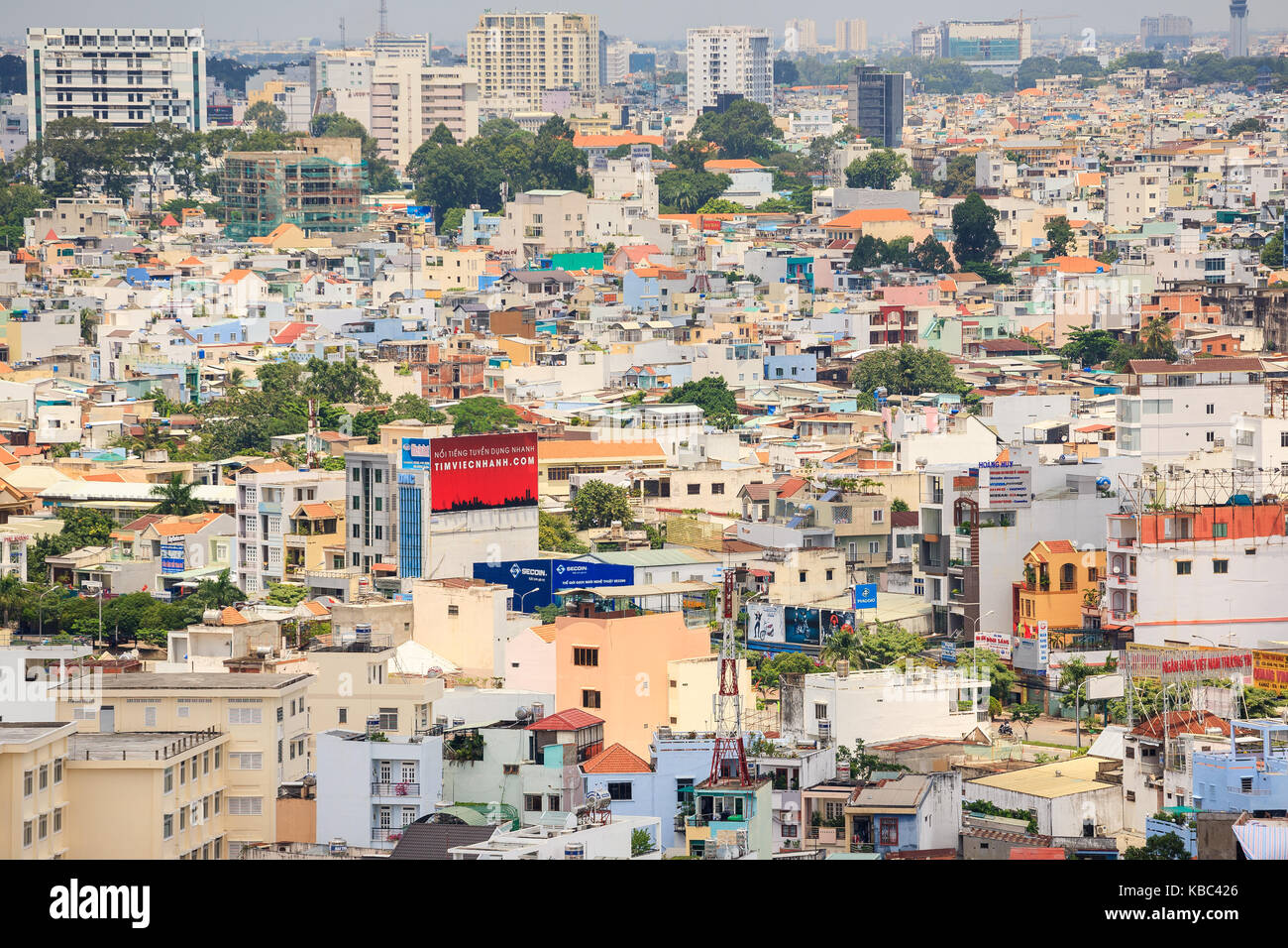 Ho Chi Minh city (or Saigon) skyline with colorful house, Vietnam. Saigon is the biggest city and economic center in Vietnam. Stock Photo