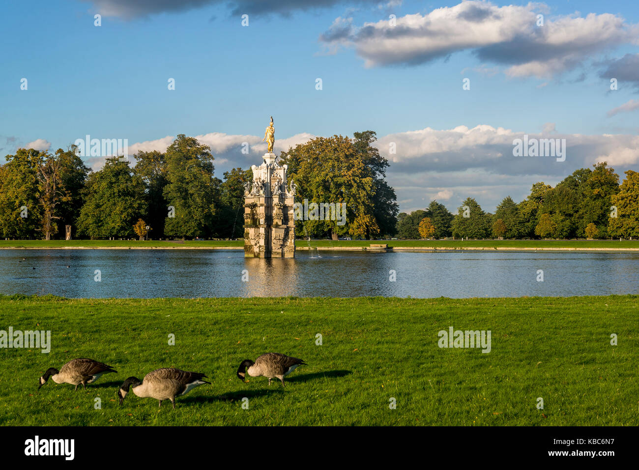 Three Canada geese and Diana Fountain, a seventeenth-century statue ensemble and water feature in an eighteenth-century setting, Bushy Park, London, E Stock Photo