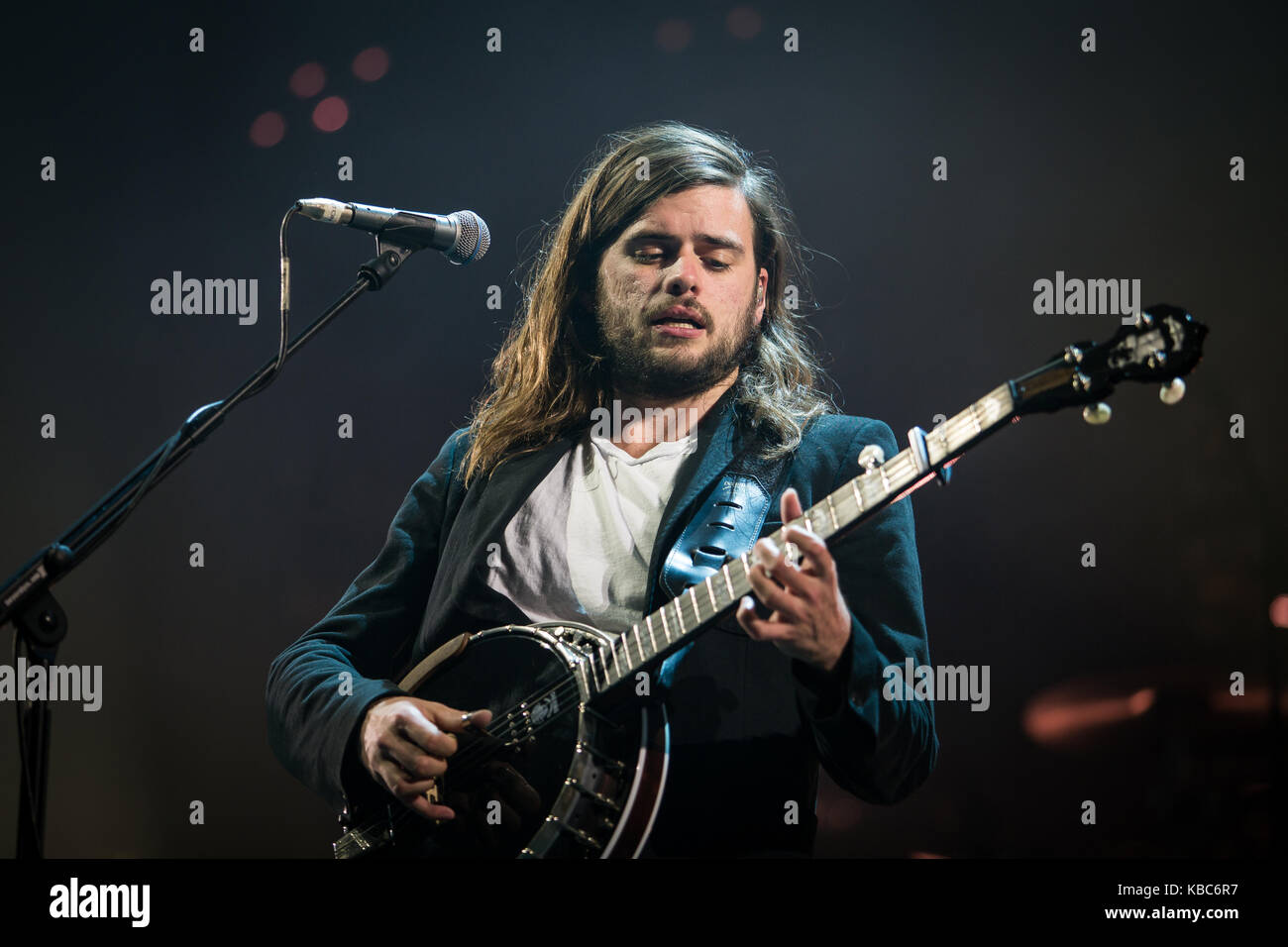 Mumford and Sons performing live on stage