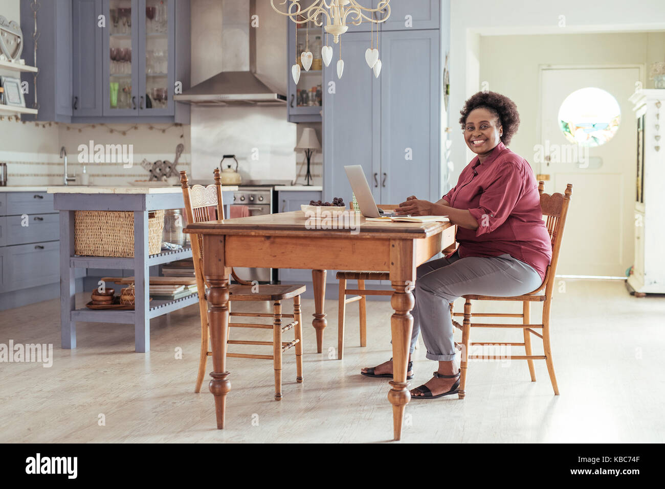 African woman sitting hi-res stock photography and images - Alamy