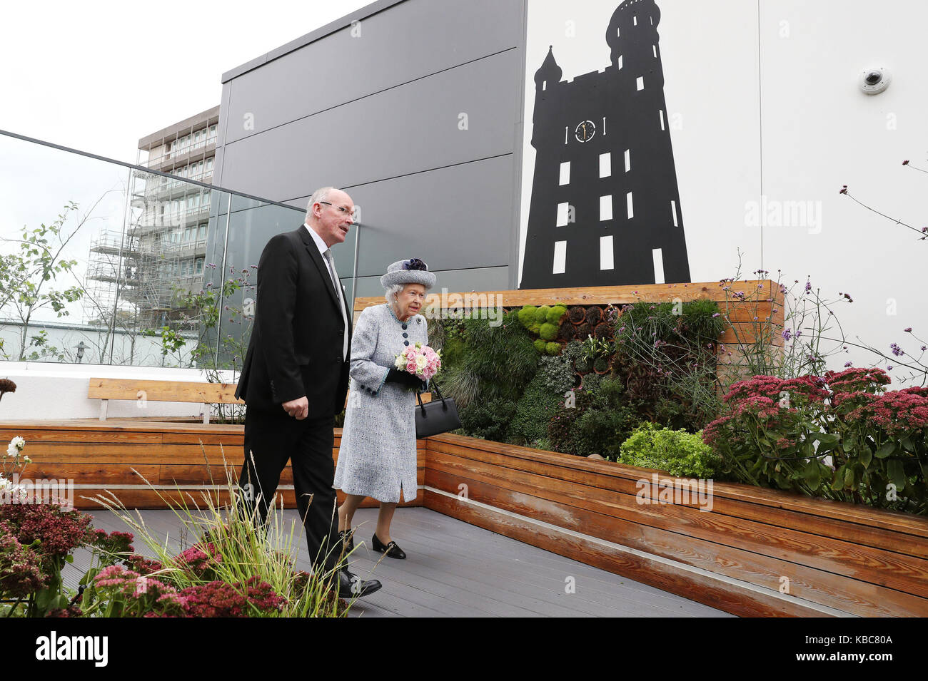 Reverend James Falconer shows Queen Elizabeth II the Robertson Family