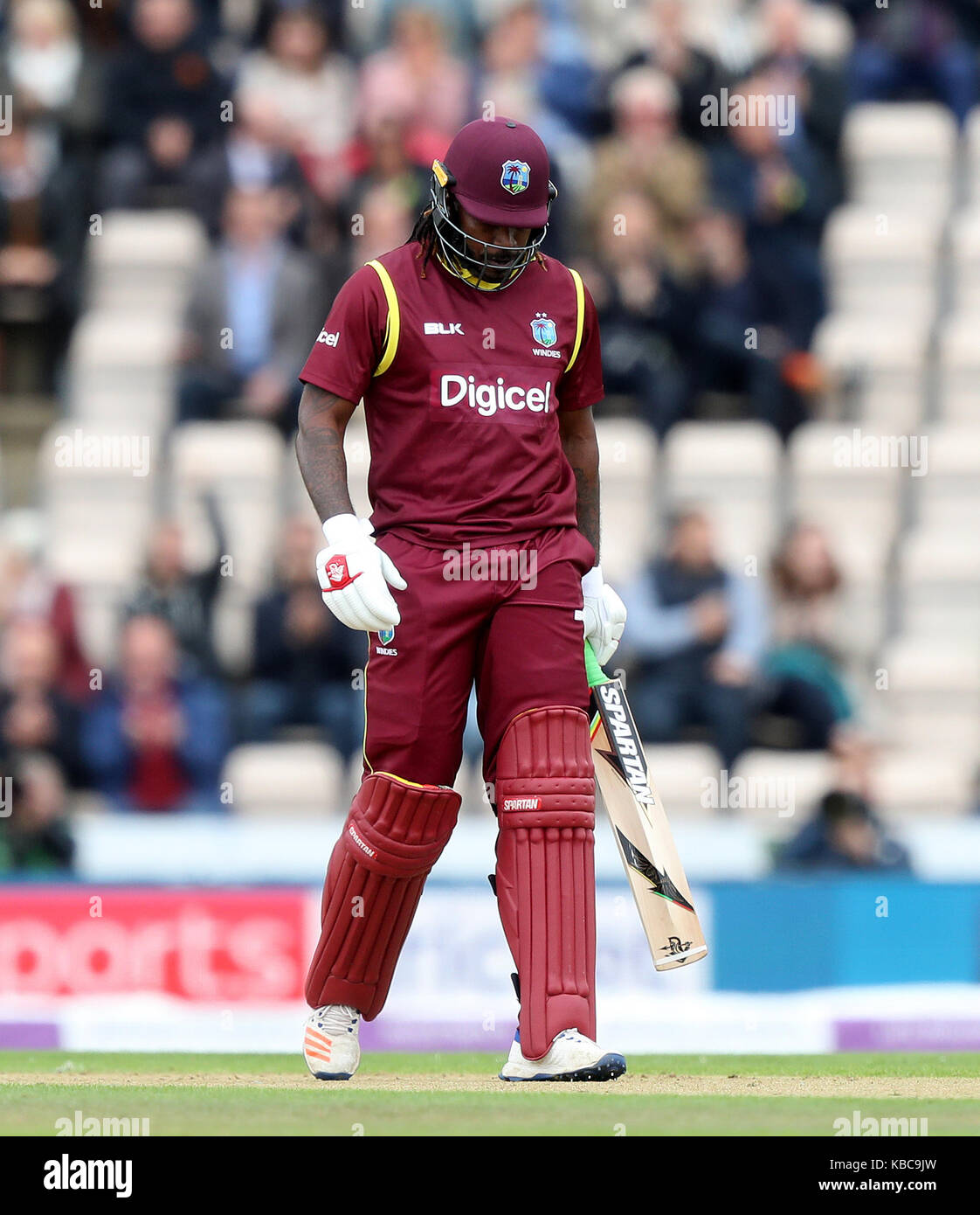 West Indies' Chris Gayle walks off after being dismissed by England's Tom Curran (not pictured) during the fifth Royal London One Day International at the Ageas Bowl, Southampton. Stock Photo