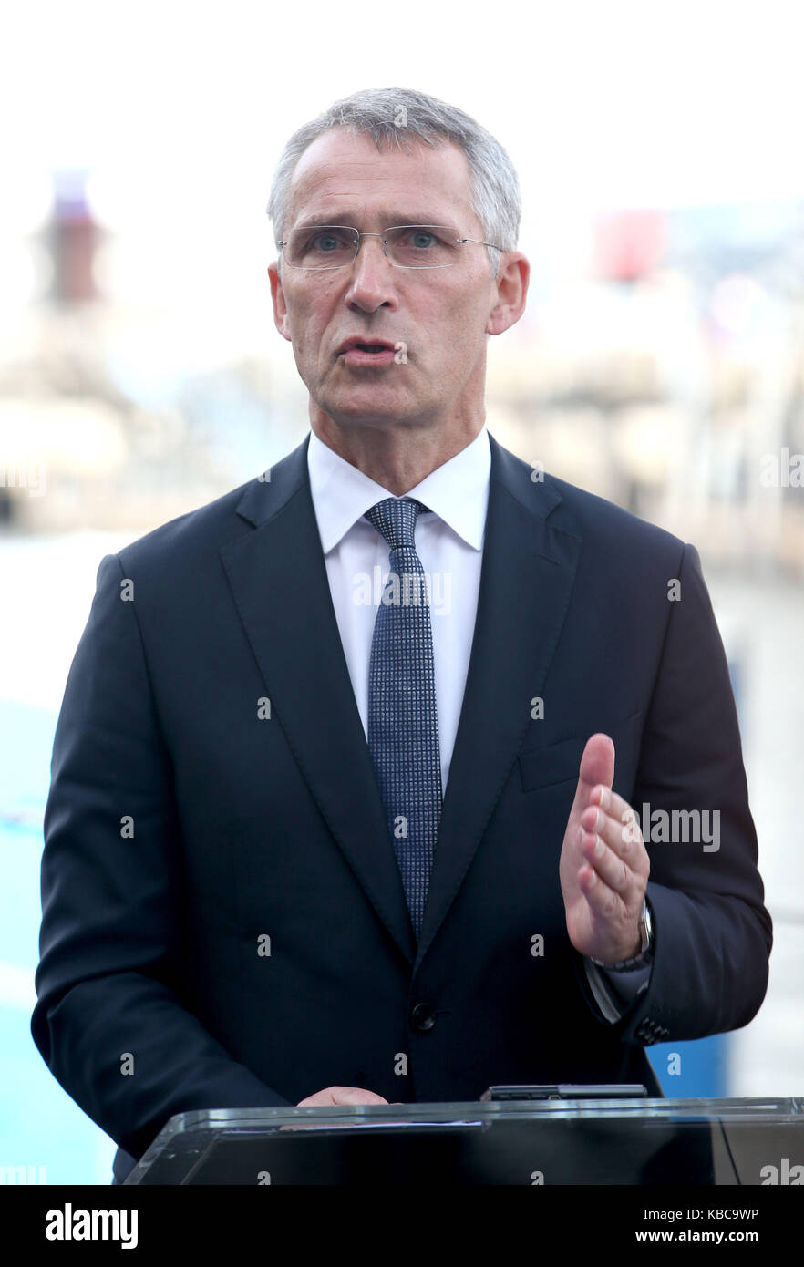Nato Secretary General Jens Stollenberg speaks to the media alongside the Vanguard-class nuclear deterrent submarine HMS Vengeance during a visit to HM Naval Base Clyde, Faslane, where bilateral talks on collective global security were held. Stock Photo