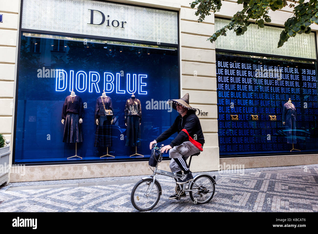 Parizska street, Prague Czech Republic Man on bike in front of Dior store Stock Photo