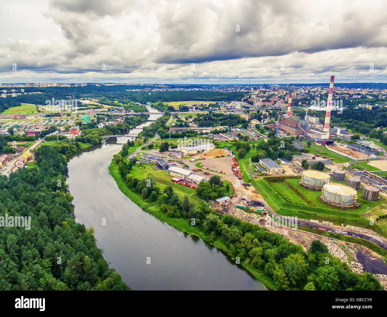 Vilnius, Lithuania: aerial UAV top view of Neris river and industrial area in Vilkpede in the summer Stock Photo