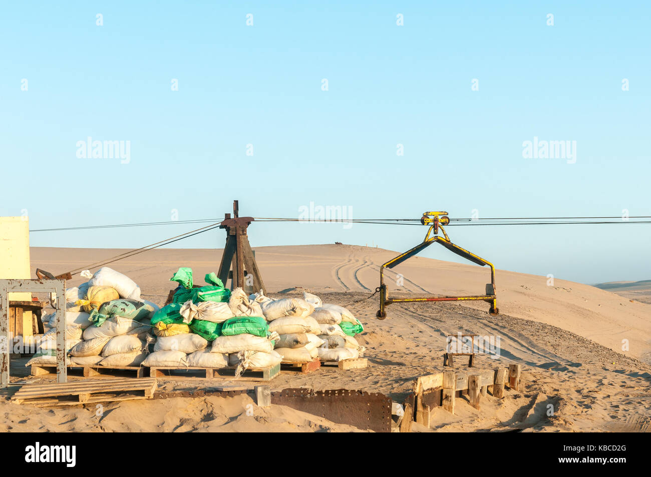 A cableway pylon and trolley at the guano island near Longbeach in the Namib Desert on the Atlantic Coast of Namibia Stock Photo